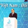 Thủ tướng Nguyễn Xuân Phúc đến dự và phát biểu khai mạc Hội nghị Thượng đỉnh Kinh doanh Việt Nam 2017 với chủ đề: “Việt Nam - Đối tác kinh doanh tin cậy”. (Ảnh TTXVN)