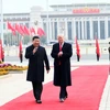Chủ tịch Trung Quốc Tập Cận Bình (phải) và người đồng cấp Mỹ Donald Trump (trái) tại lễ đón ở Bắc Kinh ngày 9/11. (Nguồn: THX/TTXVN)