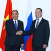 Thủ tướng Nguyễn Xuân Phúc gặp Thủ tướng Nga Dmitry Medvedev. (Ảnh: Thống Nhất/TTXVN)
