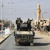 Các lực lượng Iraq tuần tra tại thành phố al-Qaim, tỉnh Anbar sau khi giải phóng thành phố này từ IS ngày 4/11. (Nguồn: AFP/TTXVN)