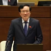 Chánh án Tòa án nhân dân Tối cao Nguyễn Hòa Bình trả lời chất vấn của đại biểu Quốc hội. (Ảnh: Phương Hoa/TTXVN)