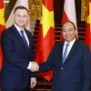 Thủ tướng Nguyễn Xuân Phúc hội kiến Tổng thống Cộng hòa Ba Lan Andrzej Duda. (Ảnh: Thống Nhất/TTXVN)