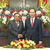 Chủ tịch nước Trần Đại Quang hội kiến với Tổng Bí thư, Chủ tịch nước Lào Bounnhang Vorachith đang thăm hữu nghị chính thức Việt Nam. (Ảnh: Nhan Sáng/TTXVN)