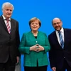 Chủ tịch CSU Horst Seehofer, Thủ tướng Đức Angela Merkel và Chủ tịch SPD Martin Schulz tại cuộc họp báo sau đàm phán ở Berlin ngày 7/2. (Nguồn: AFP/TTXVN)
