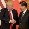 Chủ tịch Trung Quốc Tập Cận Bình (phải) và Tổng thống Mỹ Donald Trump trong cuộc gặp tại Bắc Kinh ngày 9/11/2017. (Nguồn: AFP/TTXVN)