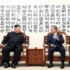 Hai nhà lãnh đạo Hàn Quốc và Triều Tiên. (Nguồn: AFP/TTXVN)