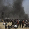 Xung đột giữa người biểu tình Palestine với binh sỹ Israel tại khu vực biên giới Dải Gaza và Israel ngày 14/5. (Nguồn: THX/TTXVN)