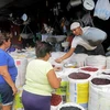 Người dân mua bán hàng hóa tại Managua, Nicaragua ngày 26/1. (Nguồn: AFP/TTXVN)