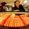 Vàng trang sức được bày bán tại một cửa hàng ở Sơn Đông, Trung Quốc. (Nguồn: AFP/TTXVN)