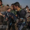 Người biểu tình Palestine bị thương trong cuộc xung đột với binh lính Israel tại biên giới Gaza-Israel ngày 15/5. (Nguồn: EPA/TTXVN)
