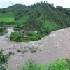 Nước sông dâng cao, chảy xiết ở con sông, suối chảy qua địa phận huyện Mường Nhé, Nậm Pồ (Điện Biên). (Ảnh: Văn Dũng/TTXVN)
