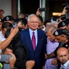 Thủ tướng Malaysia Najib Razak (giữa) sau phiên tòa ở Kuala Lumpur ngày 4/7. Ảnh: (Nguồn: THX/TTXVN)