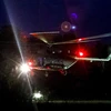 Máy bay trực thăng hạ cánh xuống sân bay quân sự ở Chiang Rai, để đưa các thành viên đội bóng tới bệnh viên sau khi họ được đưa ra khỏi hang. (Ảnh: AFP/TTXVN)