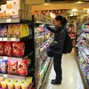 Hàng hóa được bày bán tại một siêu thị ở Bắc Kinh, Trung Quốc. (Nguồn: AFP/ TTXVN)