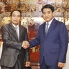 Chủ tịch UBND thành phố Hà Nội Nguyễn Đức Chung tiếp Phó Thủ tướng, Tổng Thanh tra Chính phủ Lào. (Ảnh: Lâm Khánh/TTXVN)