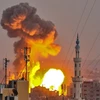 Một vụ nổ xảy ra khi quân đội Israel tấn công các mục tiêu của phong trào Hồi giáo Hamas tại Dải Gaza ngày 20/7. (Nguồn: AFP/TTXVN)