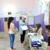 Cử tri Iraq bỏ phiếu tại một địa điểm bầu cử ở Baghdad. (Nguồn: THX/TTXVN)