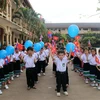 Học sinh lớp 1 của Trường Song ngữ Lào-Việt Nguyễn Du trong ngày khai giảng. (Ảnh: Phạm Kiên/TTXVN)