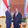 Thủ tướng Nguyễn Xuân Phúc hội kiến Tổng thống Indonesia Joko Widodo. (Ảnh: Thống Nhất/TTXVN)