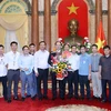 Ngày 25/7/2016, tại Phủ Chủ tịch, nhóm phóng viên chuyên trách chúc mừng Đại tướng Trần Đại Quang được Quốc hội khóa XIV bầu làm Chủ tịch nước CHXHCN Việt Nam. (Ảnh: Nhan Sáng/TTXVN)