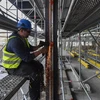 Công nhân làm việc tại một công trường xây dựng ở Berlin, Đức. (Ảnh: AFP/TTXVN)