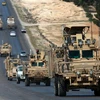 Các lực lượng do Mỹ hậu thuẫn tuần tra tại thị trấn Manbij, Syria ngày 3/4. (Ảnh: AFP/ TTXVN)