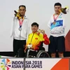Vận động viên Võ Thanh Tùng giành Huy chương Vàng tại Asian Para Games. (Ảnh: Tấn Phúc/Vietnam+)