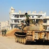 Binh sĩ Syria tiến vào giải phóng thị trấn Nuaimeh, gần cửa khẩu Nasib ngày 6/7. (Nguồn: THX/ TTXVN)