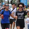 Hơn 10.000 người tham gia chương trình chạy bộ Fun Run gây quỹ từ thiện lần thứ 18 do Hiệp hội Các doanh nghiệp Anh quốc tại Việt Nam tổ chức tại Quận 7, Thành phố Hồ Chí Minh sáng 30/9. (Ảnh: Xuân Dự/TTXVN)