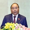 Thủ tướng Chính phủ Nguyễn Xuân Phúc trình bày Báo cáo về tình hình kinh tế-xã hội năm 2018 và kế hoạch phát triển kinh tế-xã hội năm 2019. (Ảnh: Thống Nhất/TTXVN)