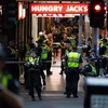 Cảnh sát điều tra tại hiện trường vụ tấn công ở Melbourne, Australia, ngày 9/11. (Ảnh: THX/TTXVN)