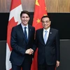 Thủ tướng Trung Quốc Lý Khắc Cường (phải) hội đàm với Thủ tướng Canada Justin Trudeau bên lề Hội nghị cấp cao ASEAN tại Singapore ngày 14/11/2018. (Ảnh: THX/ TTXVN)