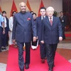 Tổng Bí thư, Chủ tịch nước Nguyễn Phú Trọng và Tổng thống Ấn Độ Ram Nath Kovind đến dự tiệc chiêu đãi. (Ảnh: Lâm Khánh/TTXVN)