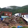 Hiện trường vụ sạt lở núi và đất cát vùi lấp nhà cửa tại xã Phước Đồng, thành phố Nha Trang . (Ảnh: Phan Sáu/TTXVN)