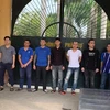 Các đối tượng trong một đường dây cho vay nặng lãi bị bắt giữ tại Thanh Hóa. (Ảnh: Trịnh Duy Hưng/TTXVN)