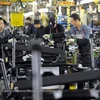 Công nhân làm việc tại một phân xưởng nhà máy sản xuất ôtô Ssangyong ở Pyeongtaek, Hàn Quốc. (Nguồn: AFP/TTXVN)