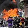 Hiện trường một vụ đánh bom ở Mogadishu, Somalia ngày 29/1. (Ảnh: AFP/TTXVN)