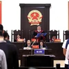 Thẩm phán, Chủ tọa phiên tòa Nguyễn Vinh Quang tuyên bản án phúc thẩm. (Ảnh: Trung Kiên/TTXVN)