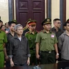Các bị cáo tại phiên tòa ngày 5/10. (Ảnh: Thành Chung/TTXVN)