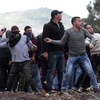 Người biểu tình Palestine đụng độ với binh sĩ Israel tại làng Kufr Qadoom, gần thành phố Nablus, Bờ Tây, ngày 15/3/2019. (Ảnh: THX/ TTXVN)