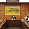 Đại tướng Tô Lâm, Bộ trưởng Bộ Công an, Đại biểu Quốc hội tỉnh Bắc Ninh thảo luận tại tổ. (Ảnh: Văn Điệp/TTXVN)