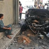 Hiện trường một vụ đánh bom ở Tripoli, Libya ngày 17/4. (Ảnh: THX/TTXVN)