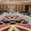 Phái đoàn Mỹ (trái) và phái đoàn Taliban (phải) tại cuộc đàm phán ở Doha, Qatar, ngày 26/2/2019. (Ảnh: AFP/ TTXVN)