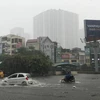Mưa lớn gây ngập cục bộ tại Hà Nội ngày 30/7. (Ảnh: Trọng Đạt/TTXVN)