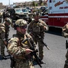 Lực lượng an ninh được triển khai tại hiện trường vụ xả súng nhằm vào siêu thị Wal-Mart ở thành phố El Paso thuộc bang Texas, Mỹ ngày 3/8/2019. (Ảnh: AFP/TTXVN)