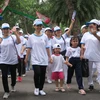 Đông đảo người dân tham gia hưởng ứng đi bộ đồng hành 'Vì nạn nhân chất độc da cam và người khuyết tật nghèo' năm 2019. (Ảnh: Đinh Hằng/TTXVN)