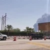Khói bốc lên từ cơ sở lọc dầu của Aramco ở Abqaiq, Saudi Arabia, sau vụ tấn công ngày 14/9/2019. (Ảnh: AFP/ TTXVN)