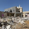 Hiện trường một vụ không kích tại khu vực ngoại ô Tripoli, Libya, ngày 14/10/2019. (Ảnh: AFP/ TTXVN)