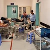 Công nhân Công ty TNHH Ấn Độ Dương, Cần Thơ bị ngộ độc thực phẩm, nhập viện điều trị tại Bệnh viện Đa khoa Trung tâm An Giang. (Ảnh: Thanh Sang/TTXVN)
