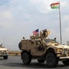 Đoàn xe của quân đội Mỹ di chuyển gần thị trấn Bardarash thuộc vùng Dohuk (Iraq) sau khi rút khỏi Syria, ngày 21/10/2019. (Ảnh: AFP/TTXVN)
